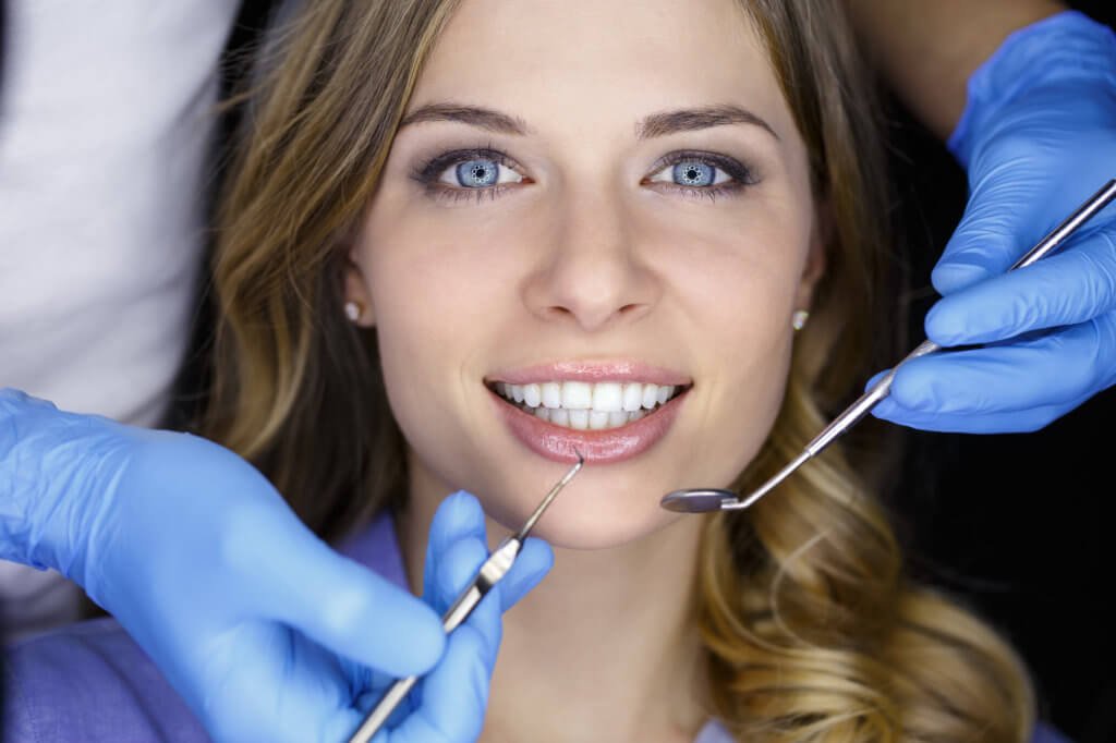 Dentist examining a patient's teeth in the dentist.